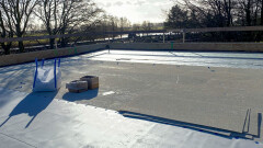 Roof under preparation with safety lines and AllShield BarrierSheet &ndash; fireproof solution making roofs insurable.