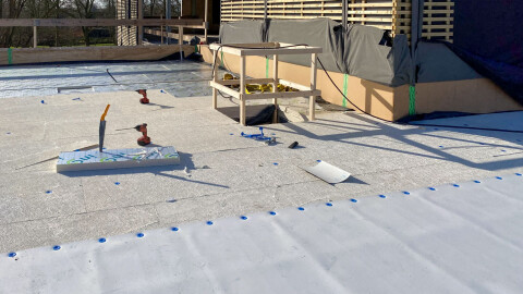 Roof with INSUS PIR double-sided aluminium insulation panels and AllShield BarrierSheets, partly covered with PVC &ndash; fireproof and insurable.