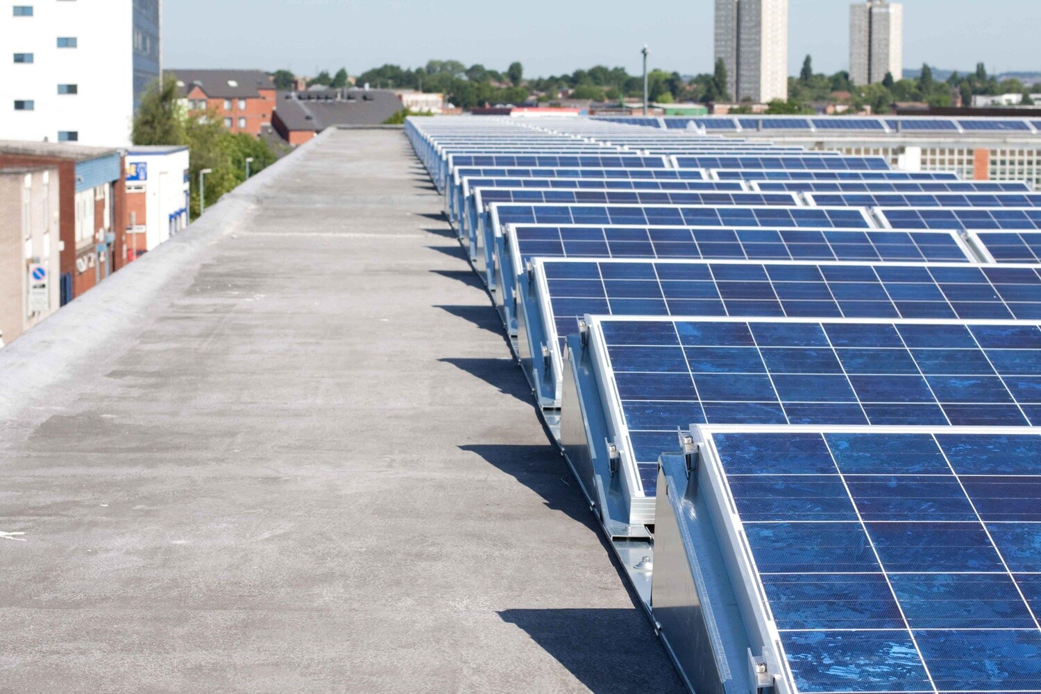 AllShield BarrierSheet non-combustible roof board installed under PV panels on a UK rooftop, supporting RC62 fire safety compliance.