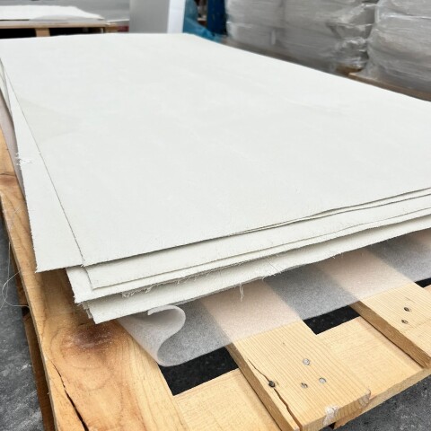 AllShield BarrierSheets provide protection beneath roofing against solar panel fire risks and flying sparks in commercial buildings.