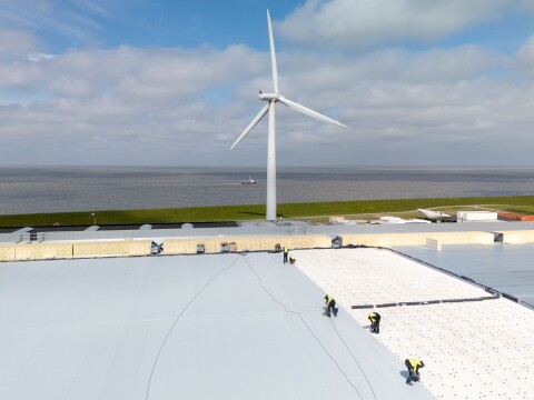 Applying PVC roofing on BarrierSheets at Campina Harlingen to guard against fire from solar panels.
