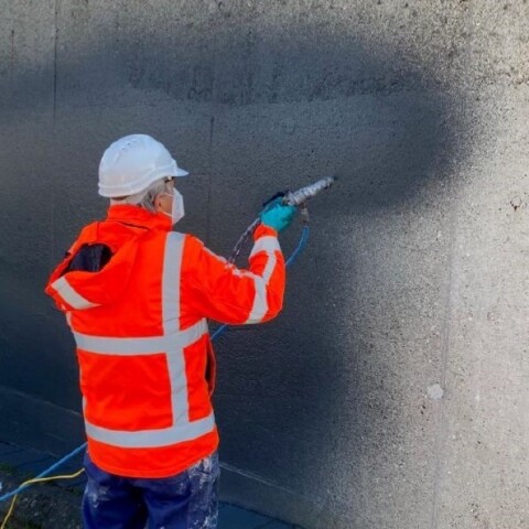 Coating concrete with AllShield CreteShield to repair and protect against moisture and acid.