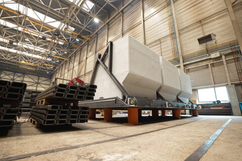 EPS flood barrier segment coated with AllShield CoreShield, staged indoors at the factory before shipment.