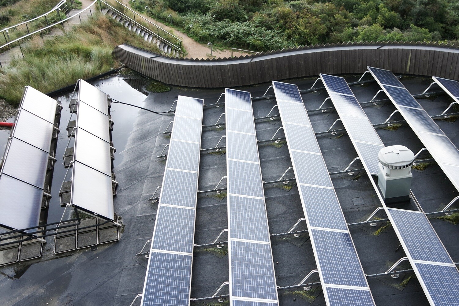 Flat roof fire safety for solar panels. QBE reports a 60% rise in rooftop fires. Use a non-combustible base with AllShield BarrierSheet or Blue.
