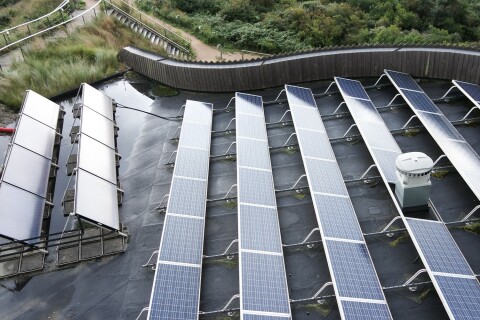 Flat roof fire safety for solar panels. QBE reports a 60% rise in rooftop fires. Use a non-combustible base with AllShield BarrierSheet or Blue.
