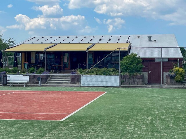 Tennisclub Tanthof clubhouse in Delft with AllShield Blue fire-safe roof coating for solar panels.